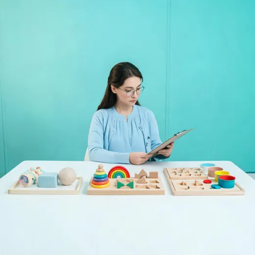 Child development specialist reviewing toy stages